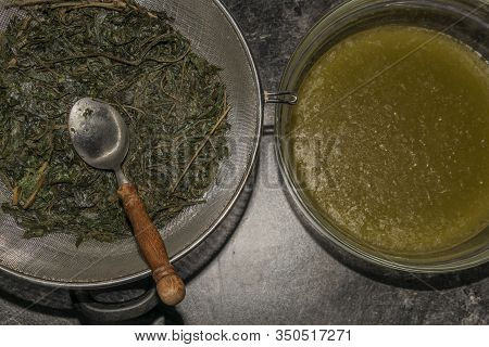 Making Of Marijuana Butter With Leafs And Yellow Butter Which Will Be Green