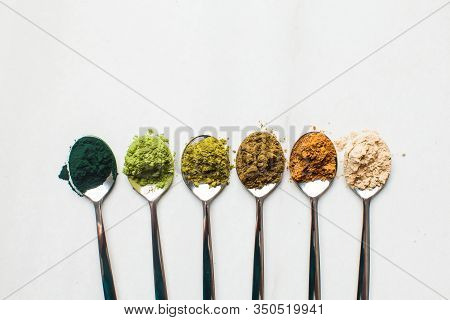 Top View Of Various Dietary Supplements In Spoons