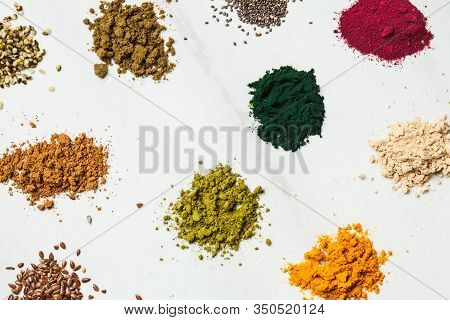 Top View Various Dietary Supplements Scattered On The Table