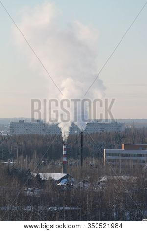 Cloud Of Smoke Rising Up From Indastrial Chimney On Background Of Cloudy Sky. Indastrial Zone In Cit