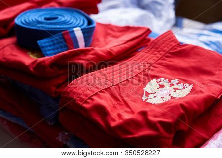 Sport Uniform With Coat Of Arms Of Russian Federation Folded And Lying On The Table With Many Other 