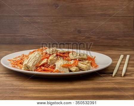 Spicy Chinese Or Korean Yuba Tofu Bamboo And Carrots Salad On Wooden Background