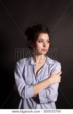 Portrait Of Beautiful Young Woman In A Blue Shirt. Sensual Girl With Make-up.
