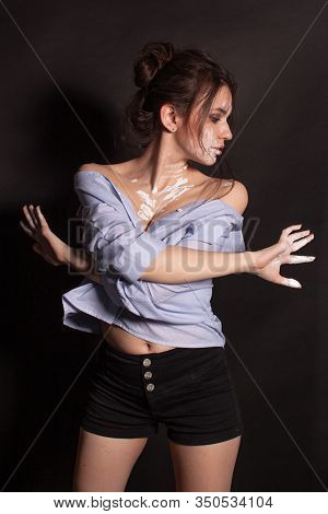 Fashion Beauty Portrait Of Beautiful Young Brunette Woman. White Paint On The Body And Face.
