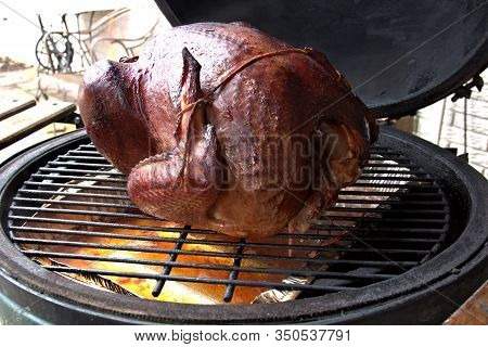 Smoking A Turkey For The Holidays Over A Pan Of Moisture