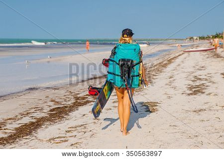 Mexico, Island Holbox - February 2020 Kite Surfing At Holbox. Girl Goes Along The Beach