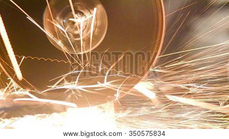 The Angle Grinder Machine Grinds Steel. Production. Metalworking.