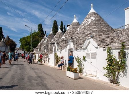 Alberobello, Italy - September 16, 2019:  People Visit Trulli Village In Alberobello, Italy. The Sty