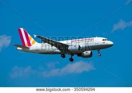 Zurich, Switzerland - July 19, 2018: From below of large colorful Germanwings airlines plane arriving at airport with clear blue sky on background
