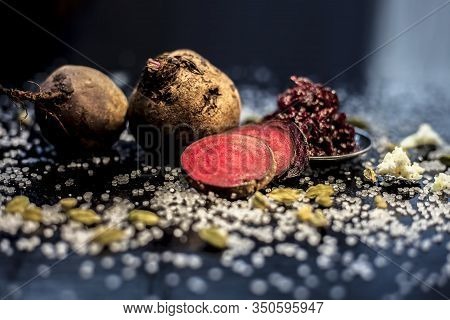 Close Up Of Fresh Beetroot Halwa Or Beet Ka Halwa In A Plate With Some Spread Sugar Crystals And Ela