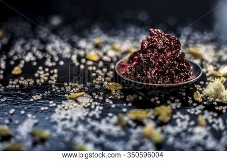 Close Up Of Fresh Beetroot Halwa Or Beet Ka Halwa In A Plate With Some Spread Sugar Crystals And Ela