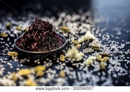 Close Up Of Fresh Beetroot Halwa Or Beet Ka Halwa In A Plate With Some Spread Sugar Crystals And Ela