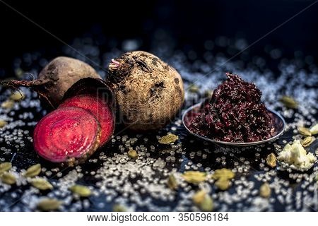 Close Up Of Fresh Beetroot Halwa Or Beet Ka Halwa In A Plate With Some Spread Sugar Crystals And Ela