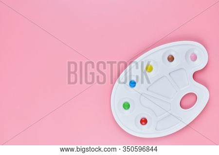 Art Of Sweetmeats Concept, Copy Space. Sweet Candy In Paint Palette On Pink Background. Love To Colo
