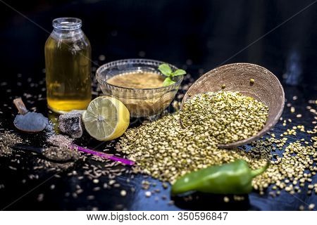 Close Up Of Mung Dal Soup In Glass Bowl Along With Entire Constituents With It Which Are Mung Bean,g