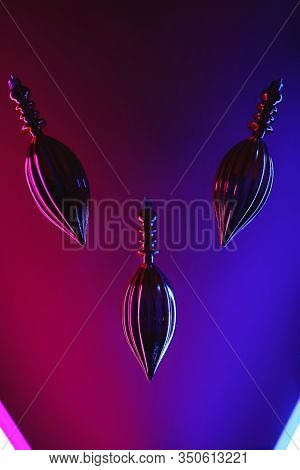 Butt Plug On Neon Background. Sex Toys For Ass. Abstract Light Blue And Pink Neon Background Texture