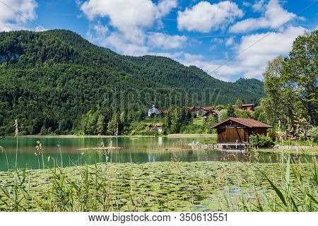 Weissensee Lake In The Bavarian Alps Near Fuessen, Allgaeu, Bavaria, Germany