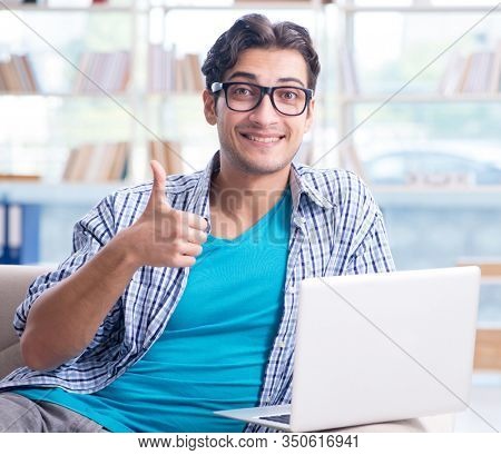 Caucasian student with laptop preparing for university exams