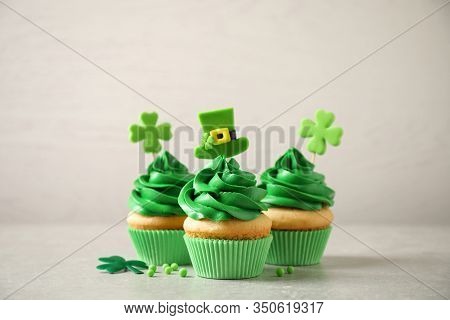 Delicious Decorated Cupcakes On Light Table. St. Patrick's Day Celebration