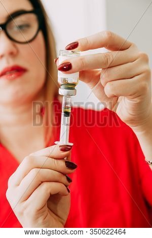 Vaccination For People, Injection. Doctor With Syringe. Coronavirus Doctor Makes Vaccination. Select