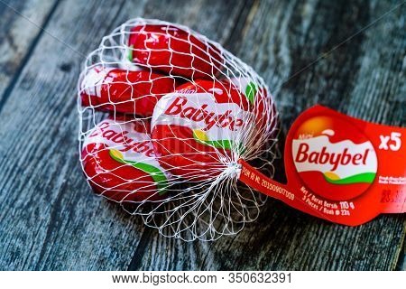 Istanbul, Turkey - February 23, 2018: Mini Babybel Cheese In Red Wax On Wooden Surface.
