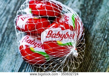Istanbul, Turkey - February 23, 2018: Mini Babybel Cheese In Red Wax On Wooden Surface.