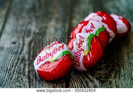 Istanbul, Turkey - February 23, 2018: Mini Babybel Cheese In Red Wax On Wooden Surface.
