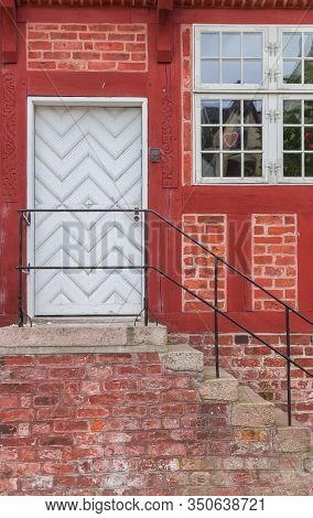 White Door In A Red Half Timbered House In Haderslev, Denmark