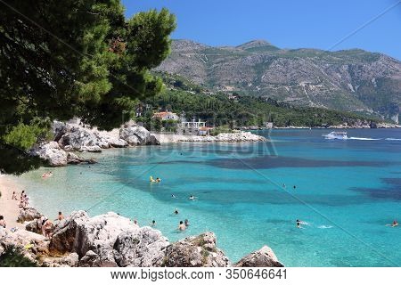 Mlini, Croatia - June 27, 2019: Tourists Enjoy Summer Vacation In Mlini Near Dubrovnik. Croatia Had 