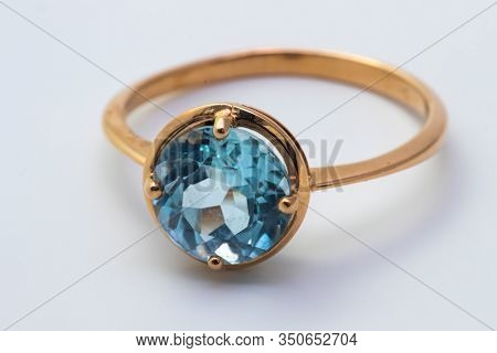 Beautiful Old Golden Ring With Blue Gemstone Isolated On White Background