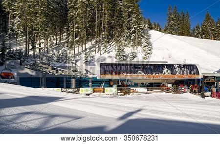 Demanovska Dolina, Slovakia - February 8: Ski-lift Chair And Skiers In Ski Resort Jasna In Low Tatra