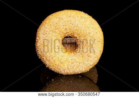 Group Of Three Whole Sweet Golden Mini Cinnamon Donut Isolated On Black Glass