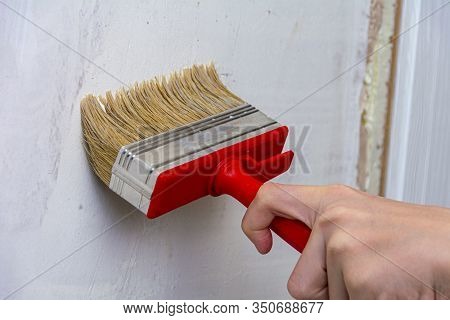 Interior Decoration Of A House Or Room. Primer The Walls With A Primer Or Paint. Repair And Priming 