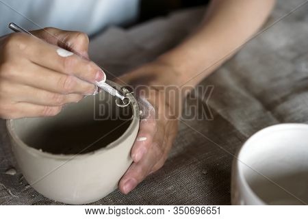 Female Hands Hold A Bowl For Casting Clay Products
