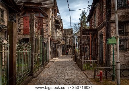 Gonzalez Catan, Argentina, September 28, 2019: People Walking Along Cobblestone Path Through Abandon