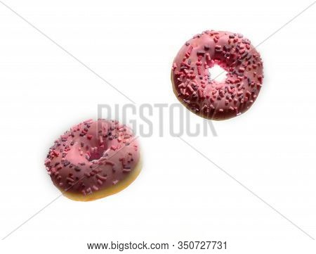Donuts With Pink Icing And Marshmellow. Unhealthy Food Concept. Flying Dougnuts On White Background.