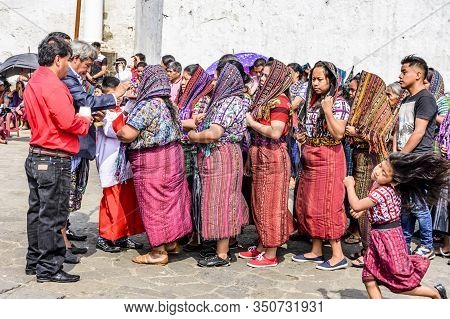 Santiago Atitlan, Guatemala -  April 19, 2019: Priest Blesses Locals Outside Church In Town Plaza Du
