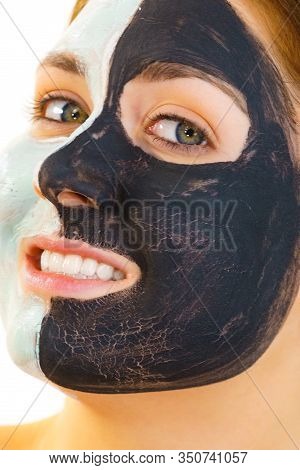 Girl With Black White Mud Mask On Face