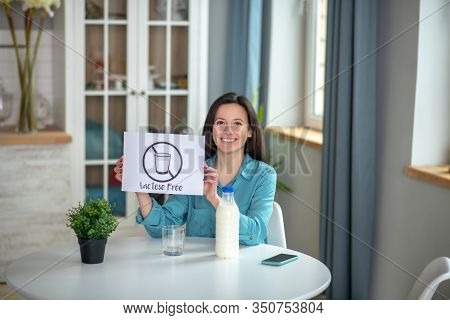 Smiling Young Woman Consuming Lactose Free Milk