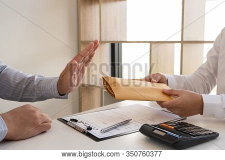 The Businessman Denies The Money In Envelope Proposed By His Partner To Bribe The Concept Of Bribery