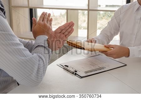 The Businessman Denies The Money In Envelope Proposed By His Partner To Bribe The Concept Of Bribery