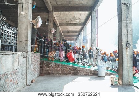 Amritsar India - Febuary 8, 2020: Crowds Of People Walk Into The Free Kitchen (langar) To Get Food I