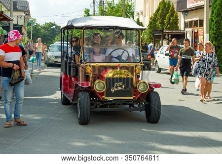 Kabardinka, Russia - August 04, 2019: Excursion Electric Car On The Streets Of The Village Of Kabard