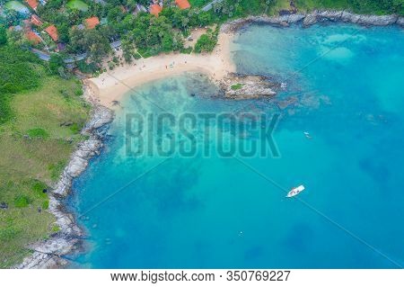Aerial View Of Beautiful Tropical Beach And Sea With Palm And Other Tree In Phuket Island For Travel