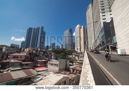 Metro Manila, Philippines - February, 12, 2020: Cityscape Of Makati And Bgc: Slums And Skyscrapers C