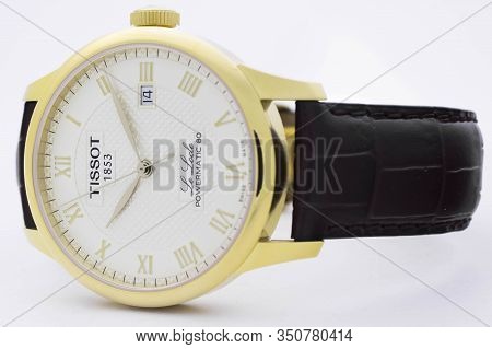 Le Locle, Switzerland 15.01.2020 - Tissot Man Watch Stainless Steel Case, Gold Pvd Coating White Clo