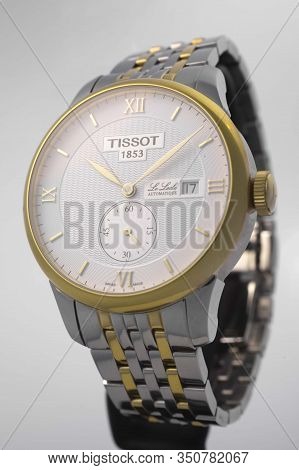 Le Locle, Switzerland 15.01.2020 - Tissot Man Watch Stainless Steel Case, Gold Pvd Coating White Clo