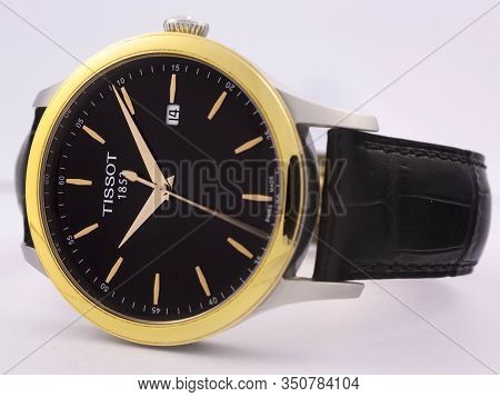 Le Locle, Switzerland 15.01.2020 - Tissot Man Watch Stainless Steel Case, Gold Pvd Coating Black Clo