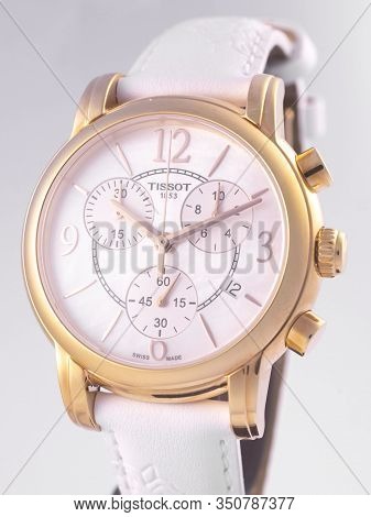 Le Locle, Switzerland 15.01.2020 - Tissot Woman Watch Stainless Steel Case, Gold Pvd Coating White C