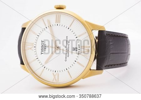 Le Locle, Switzerland 15.01.2020 - Tissot Man Watch Stainless Steel Case, Gold Pvd Coating White Clo